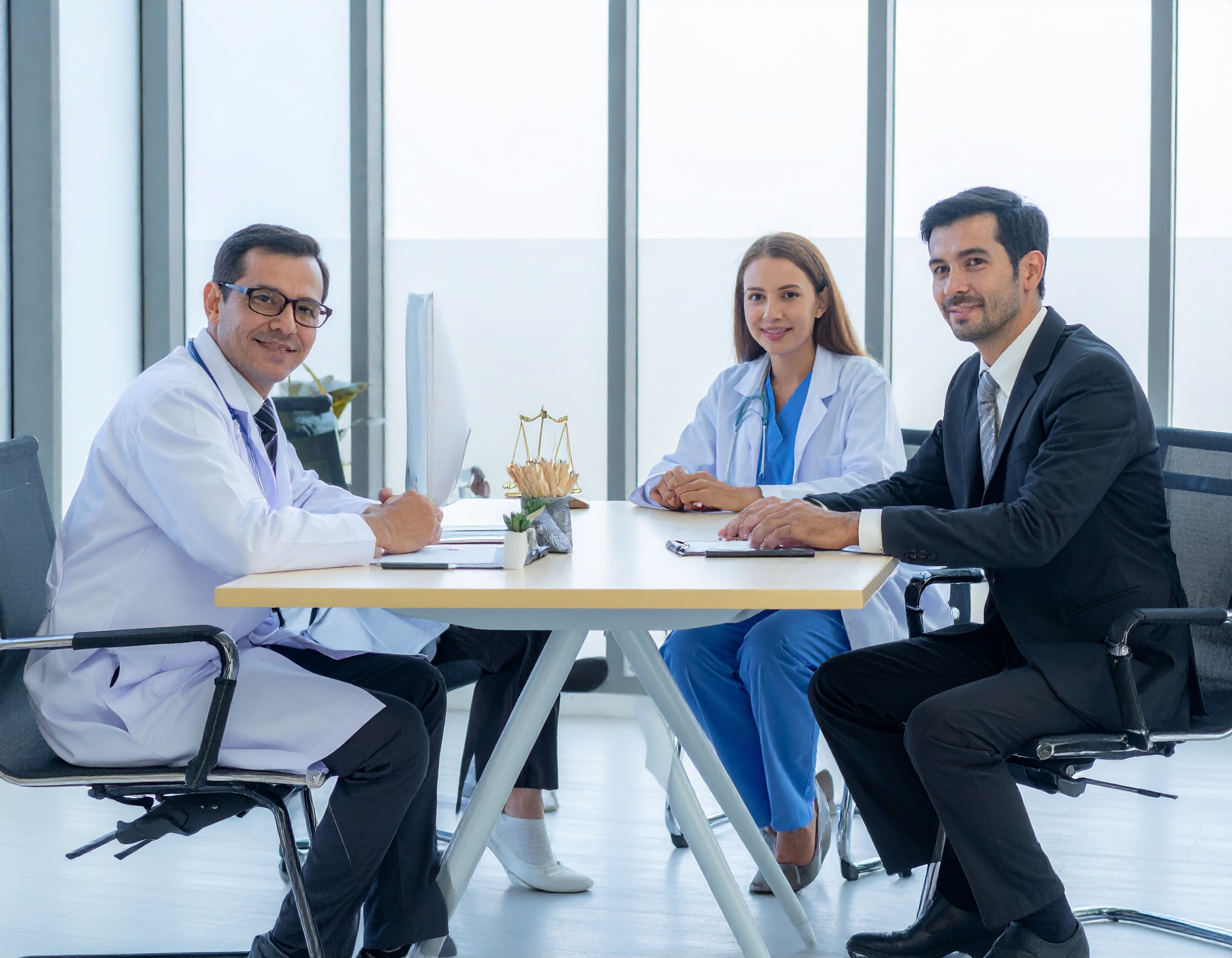 Firefly create an image showing doctors in a professional environment meeting with a lawyer 162174 - Griffith Barbee